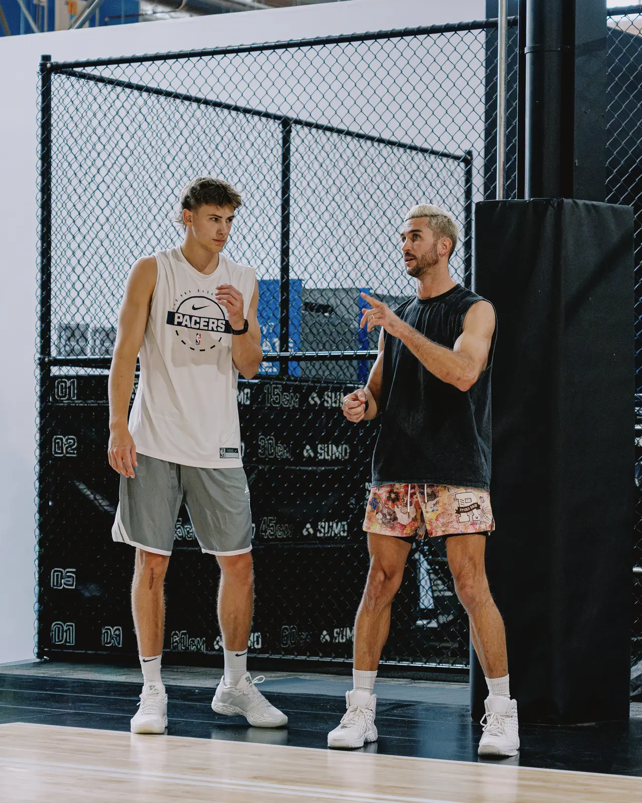 Jordan Lawley coaching a player one on one