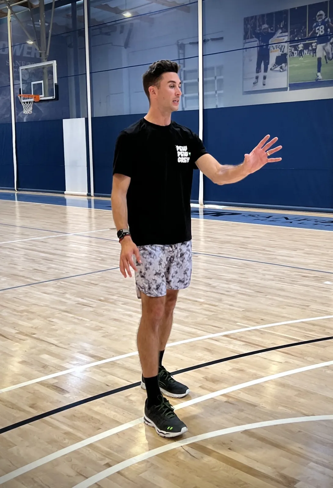 Jordan Lawley coaching on the floor